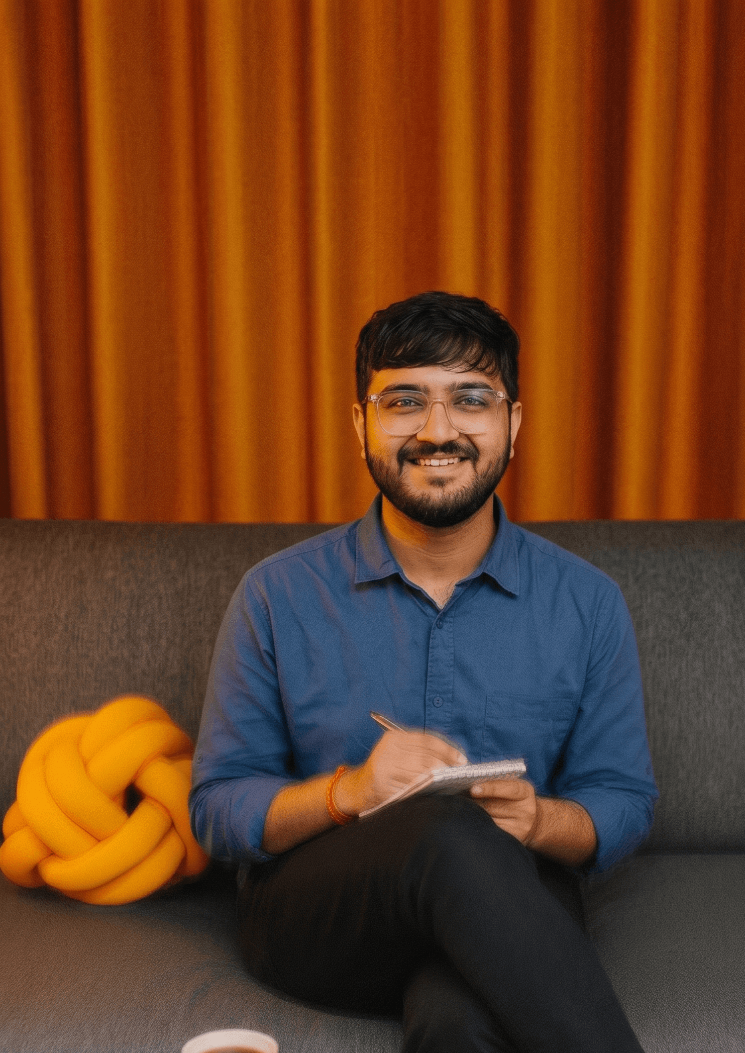 Upsure team member taking notes on a couch